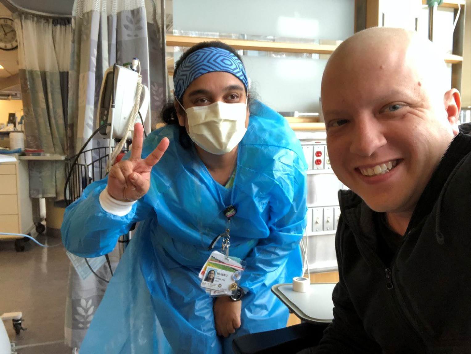 Marc and Lakeridge Health Oshawa nurse, Munnu, take a selfie as Marc gets chemotherapy treatment. 