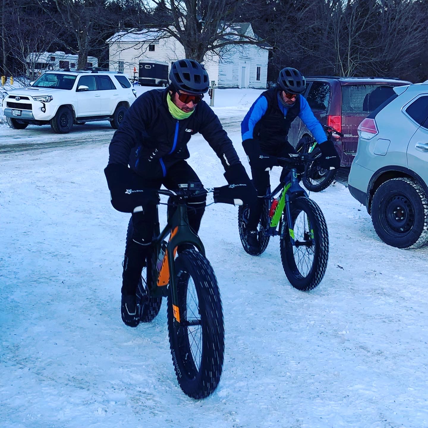 Matt and Kyle cycling in the snow