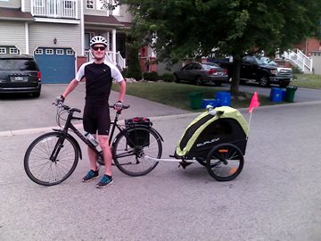 James on a bike with child bike trailer